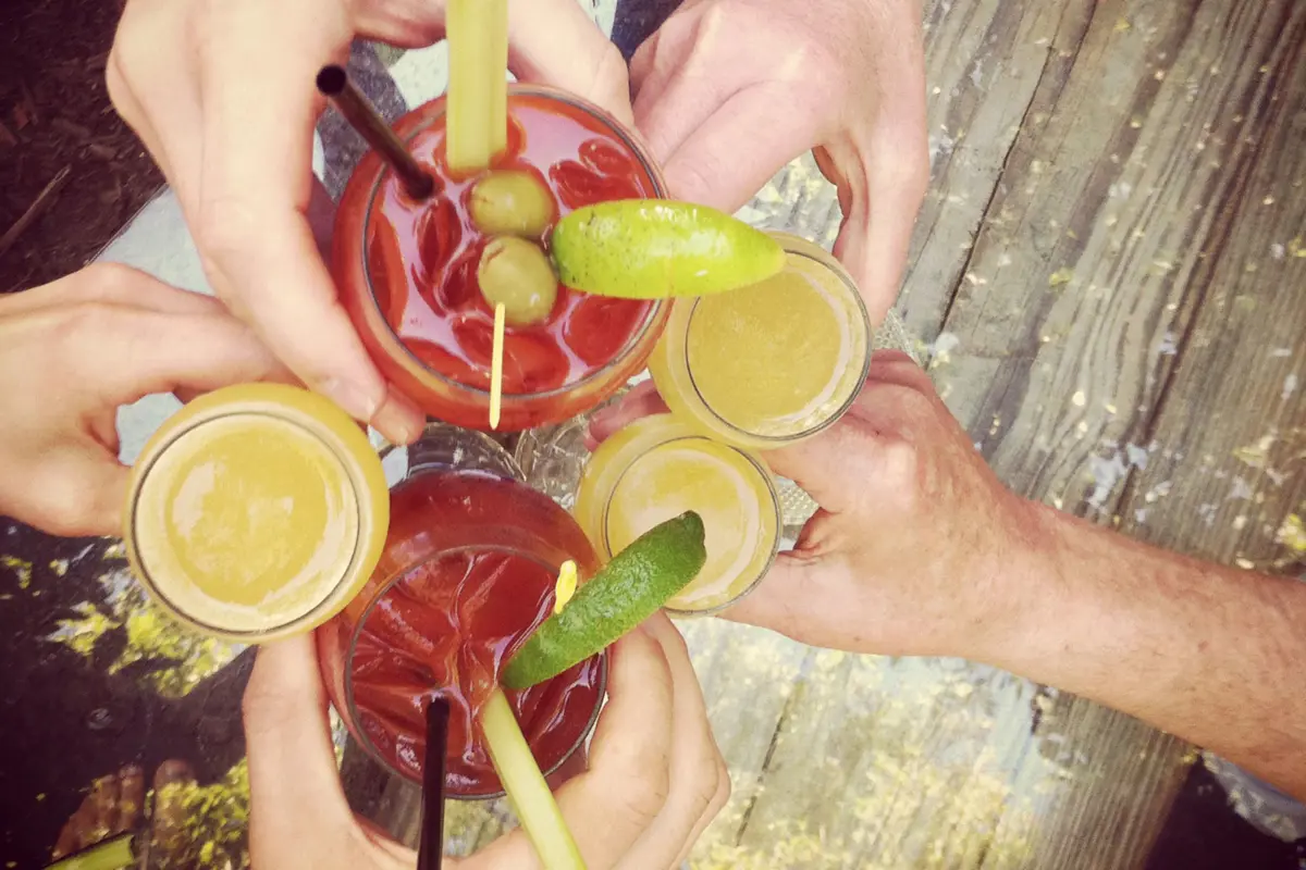  A group of friends raising their glasses to toast